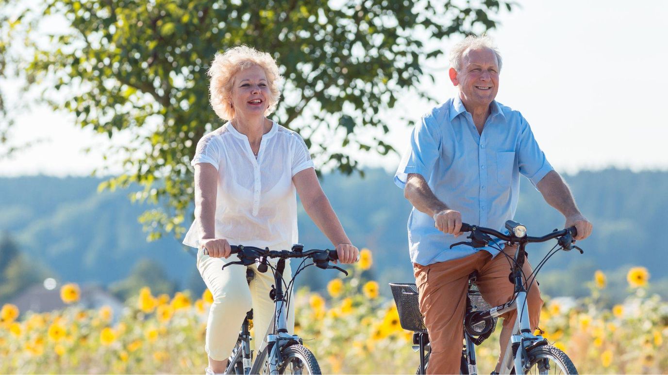 Nurse Care of Buckhead, Nursing Home in Atlanta, GA — Seniors riding bicycles in a sunflower field