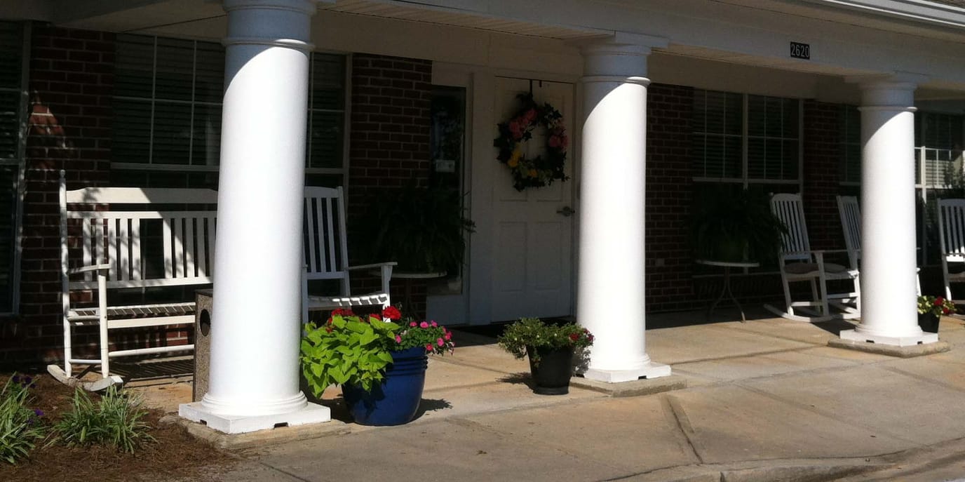 Entrance area of a senior living facility with rocking chairs