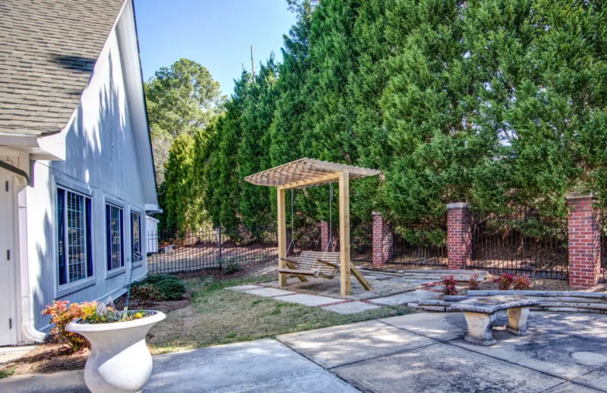Outdoor space with a seating area and landscaping