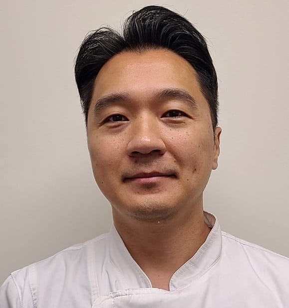 Mesun Senior Living, assisted living in Suwanee, GA — Portrait of a smiling male chef in uniform