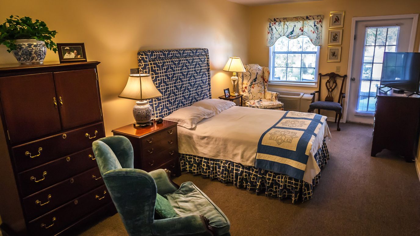Cozy private resident room with a bed and decor