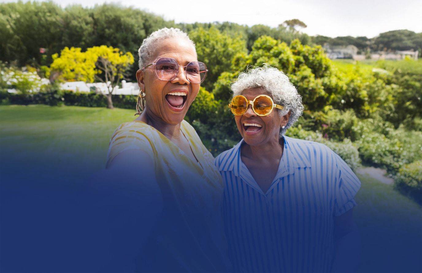 The Landings of Canton Hills, assisted living in Canton, GA — Two smiling women posing outdoors in bright sunshine