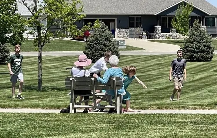 Residents and family enjoying time outdoors in the park