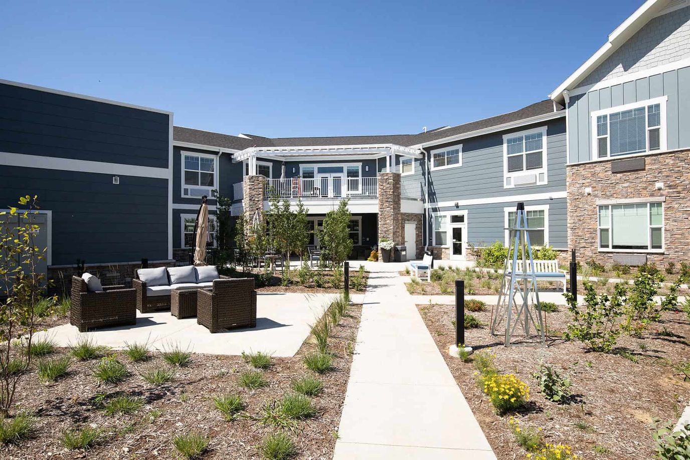 Outdoor seating area with pathways and garden