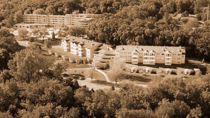 Aerial view of Meth Wick Health Center campus surrounded by trees