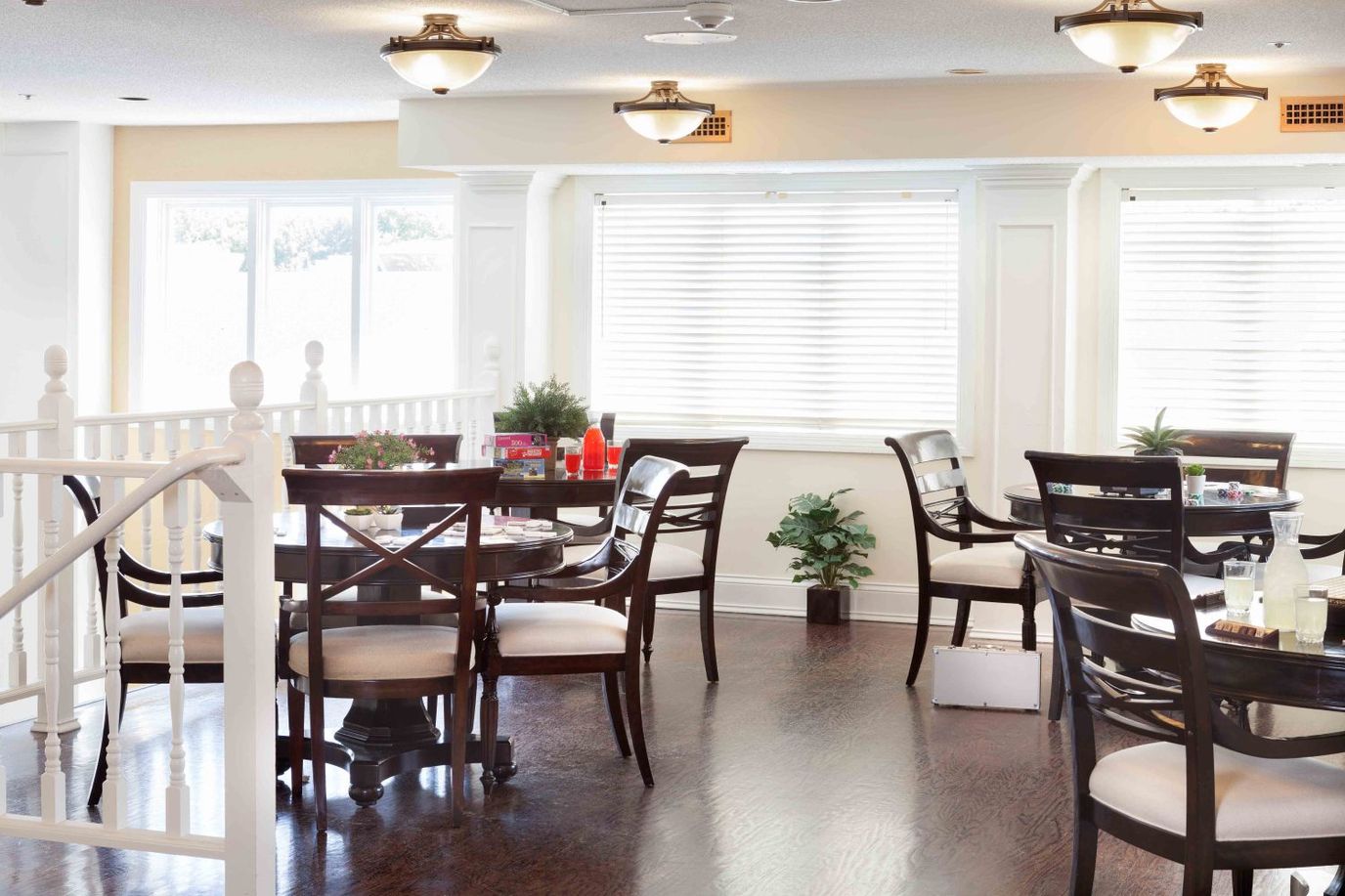 Bright dining area with wooden tables and chairs