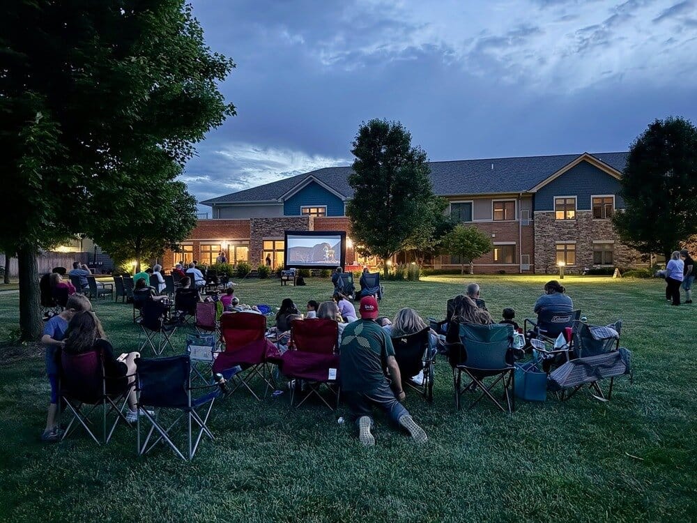 Residents enjoying an outdoor movie night