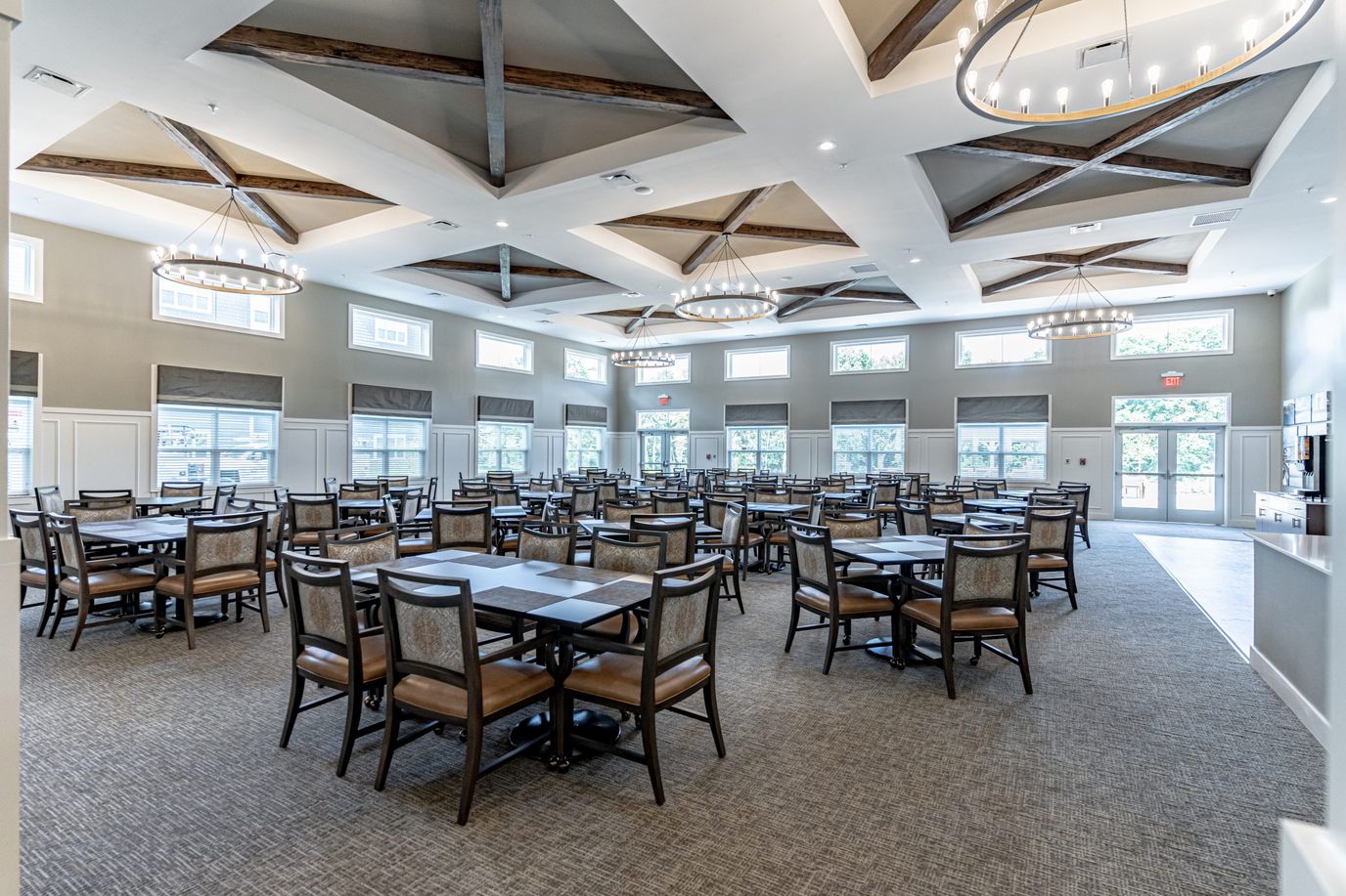 Dining room with tables and chairs in a bright setting