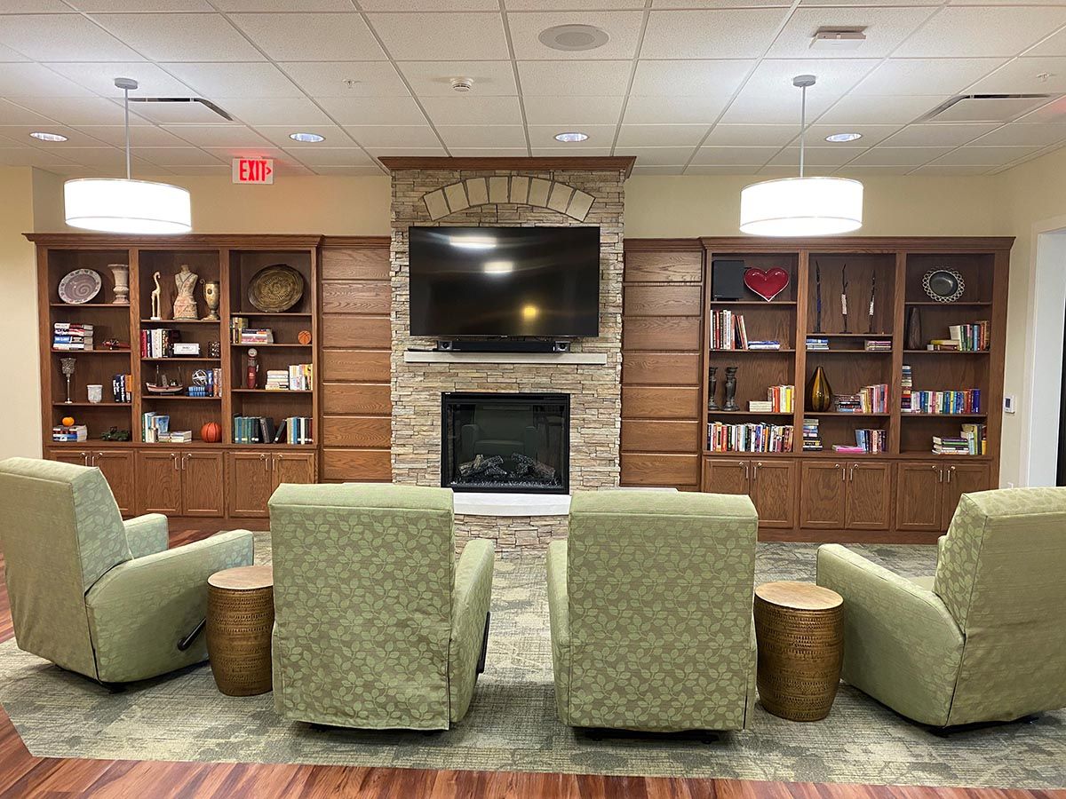 Interior common area with seating and bookshelves