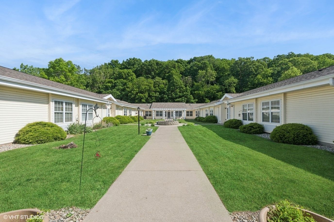 Pathway leading through landscaped grounds of the facility