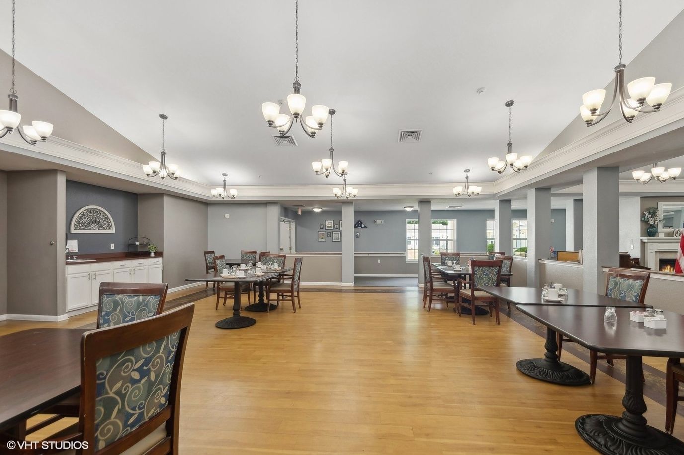 Bright dining room with tables set for meals