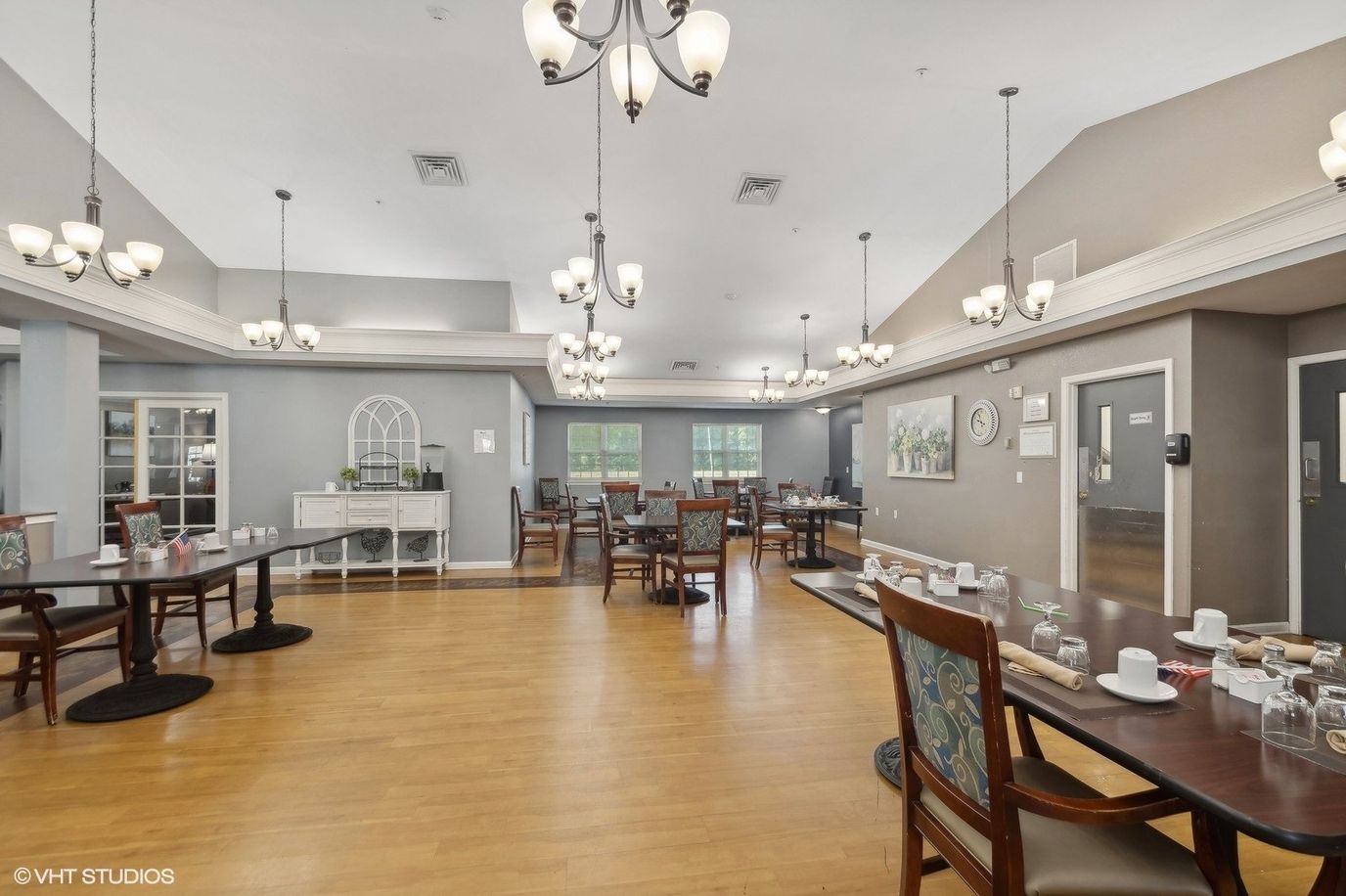 Bright dining room setup with tables and dishes