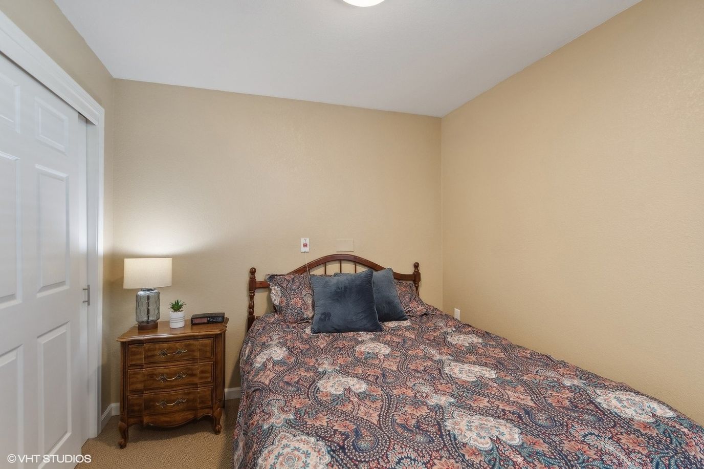 Cozy private bedroom with patterned bedding