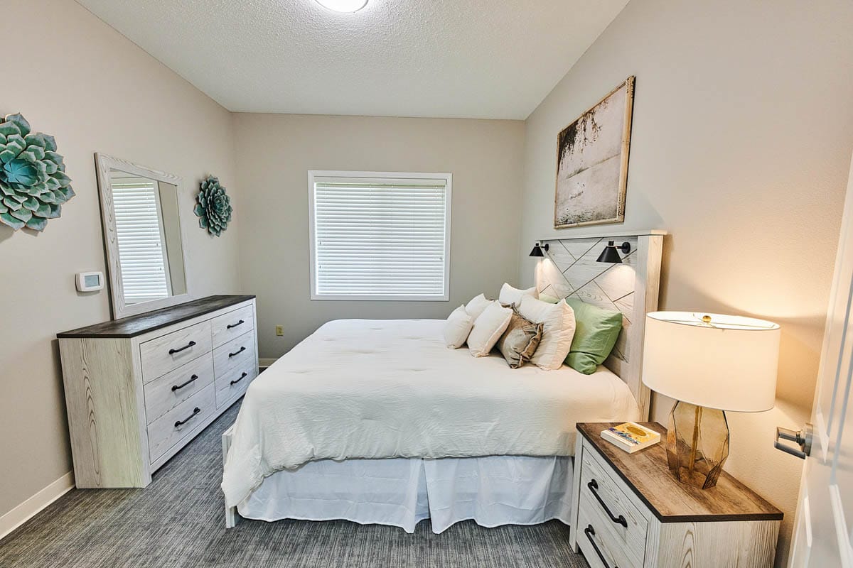 Cozy private room with a bed and dresser