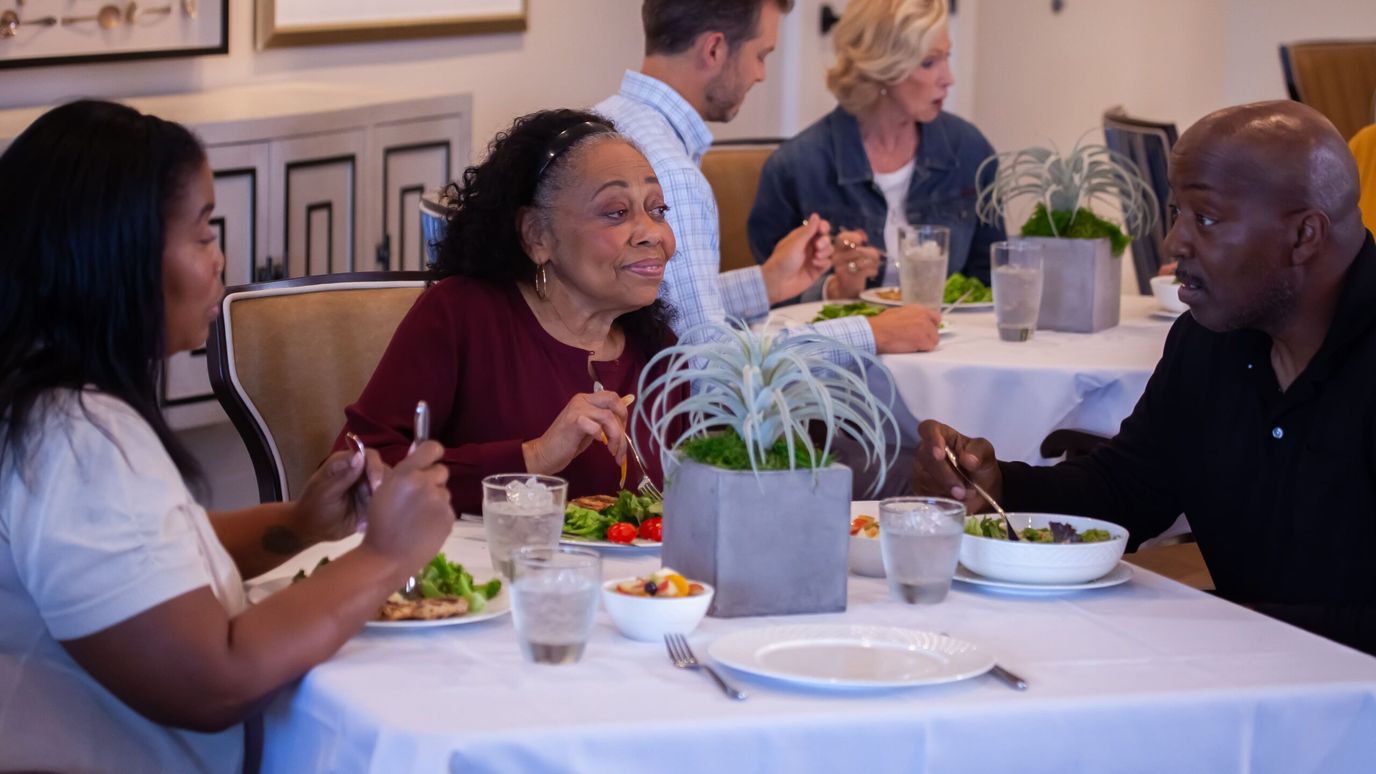 Residents enjoying a meal in the dining area