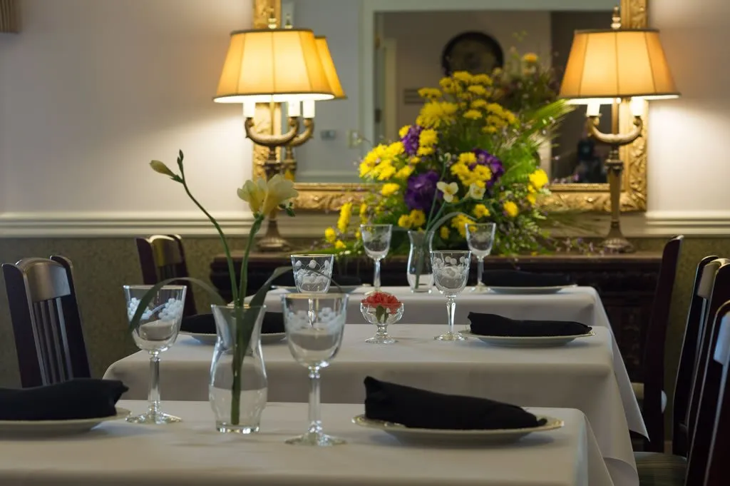 Elegant dining room setup with floral centerpiece