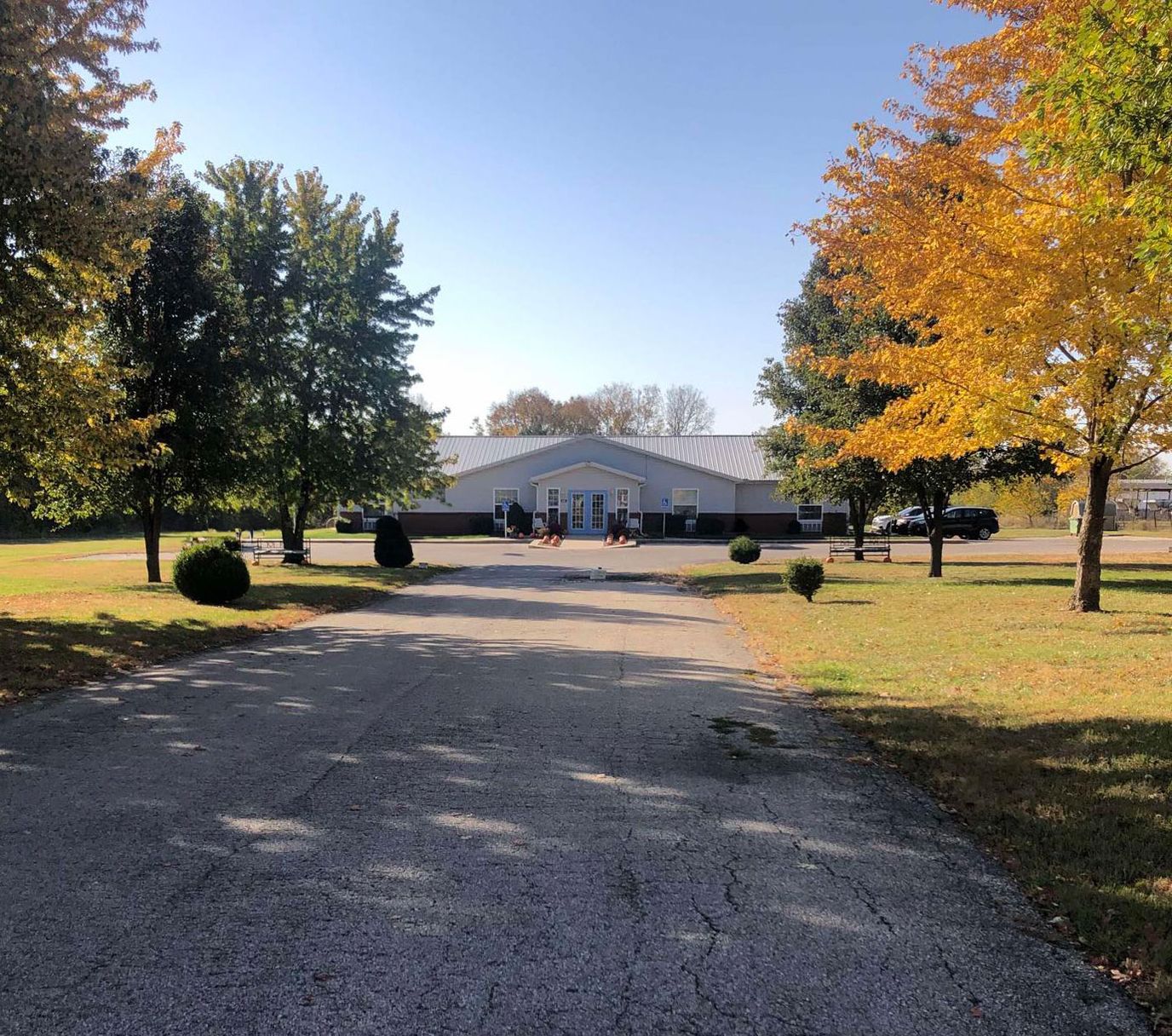 Exterior view of Guest Home Estates Vii surrounded by trees