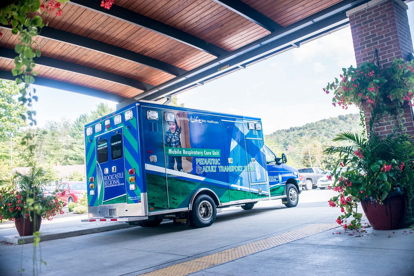 An ambulance parked at the entrance of the facility