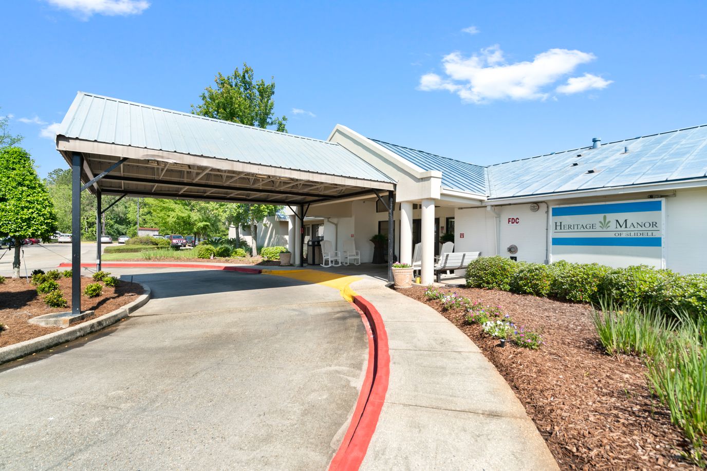 Heritage Manor of Slidell, Nursing Home in Slidell, LA — Entrance to Heritage Manor of Slidell with landscaped surroundings