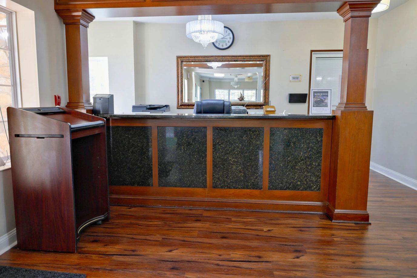Reception area with wooden accents and a large mirror