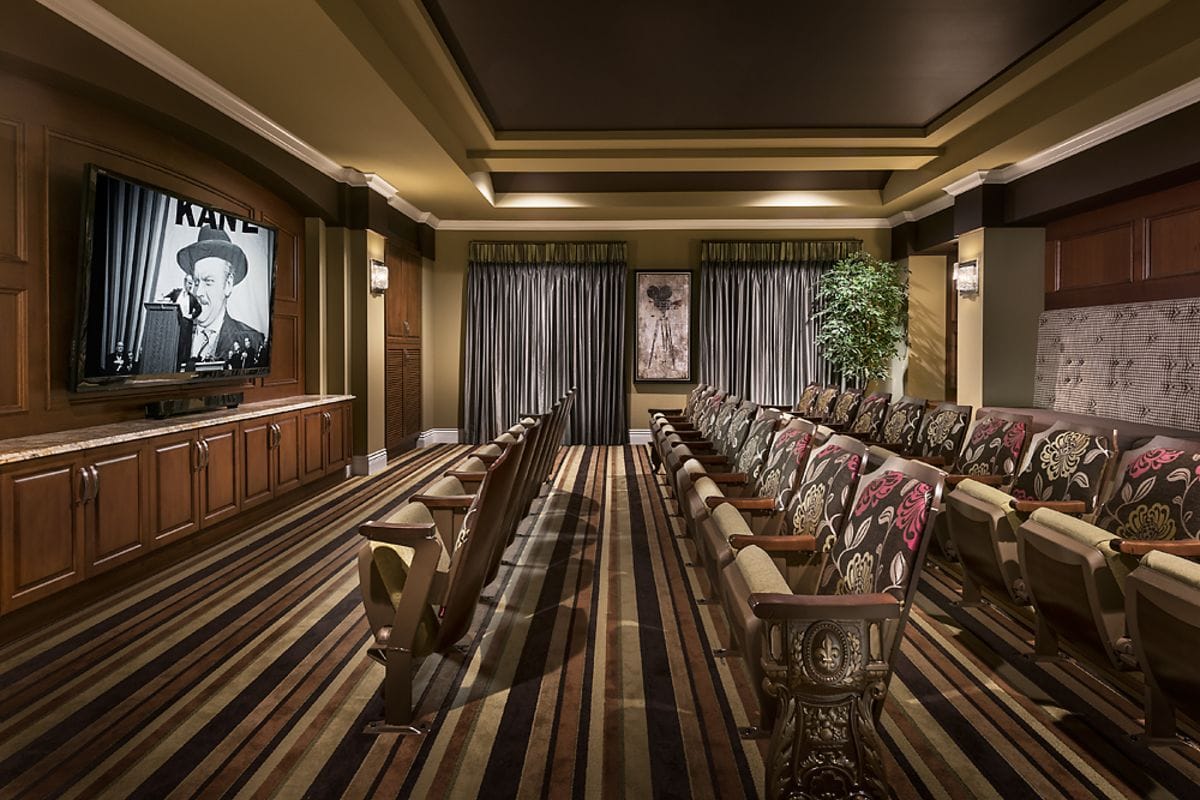 Cozy theater room with comfortable seating and large screen