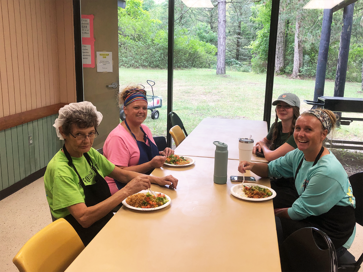 Staff and residents enjoying a meal in the dining room