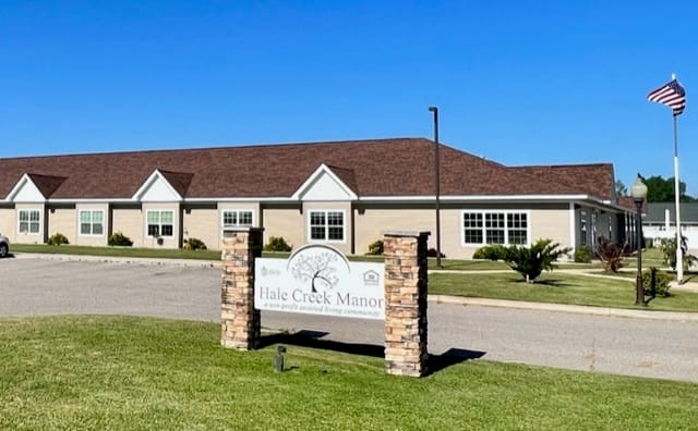 Exterior view of Hale Creek Manor facility with signage