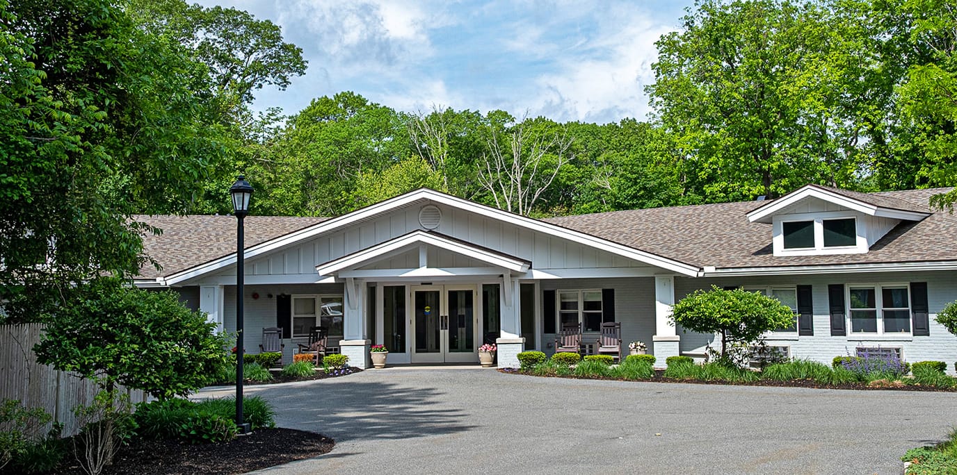Exterior view of senior living facility with landscaped entrance