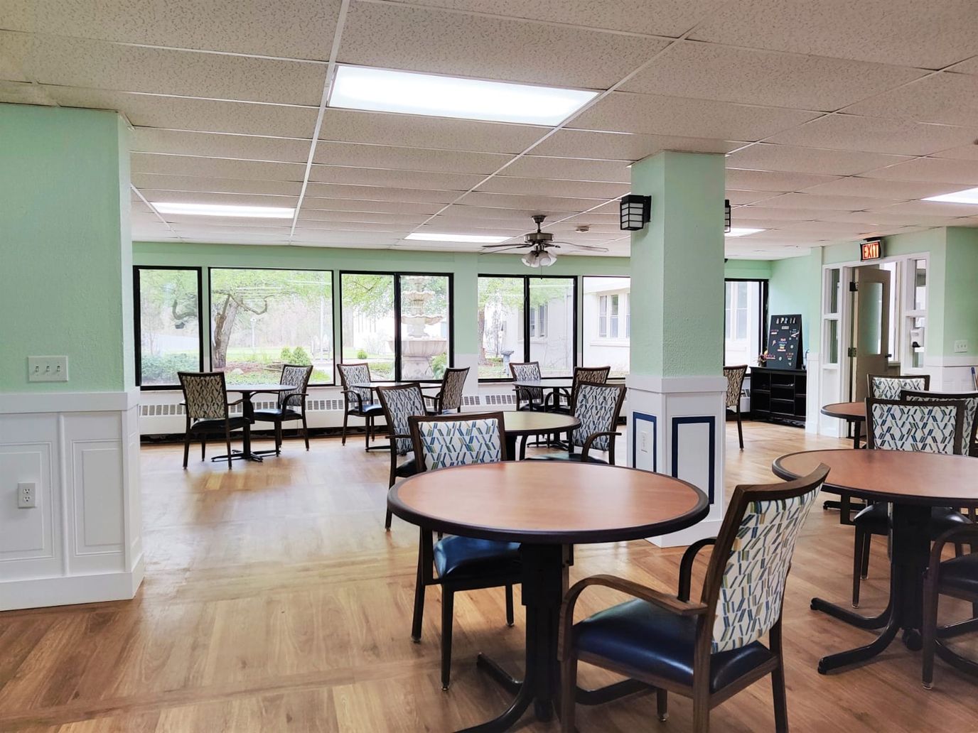 Bright common area with tables and chairs
