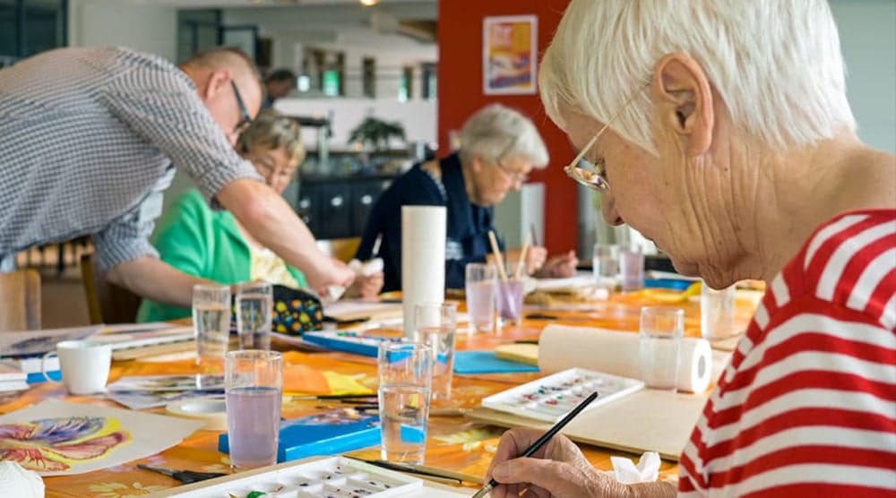 The Harbor At Peace Village, assisted living in Norwood Youngamerica, MN — Seniors participating in a watercolor painting class