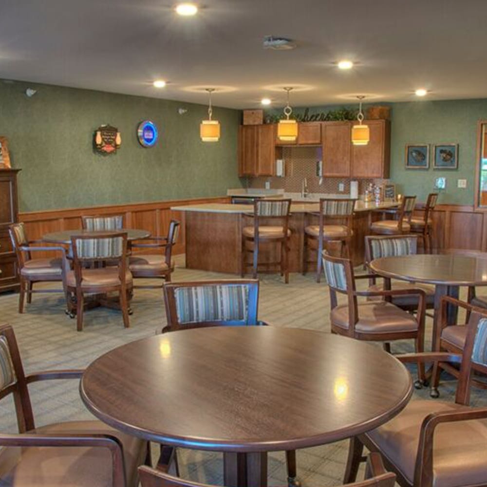 Cozy common area with tables and chairs for residents