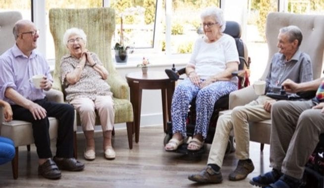 Residents sharing laughter in a common area