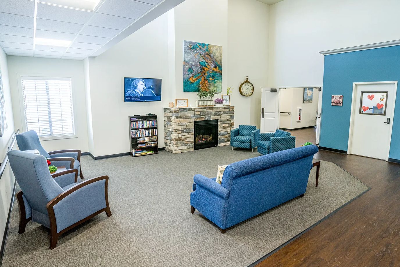 Bright common area with seating and television