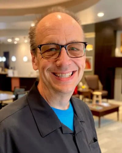 Staff member smiling in a common area