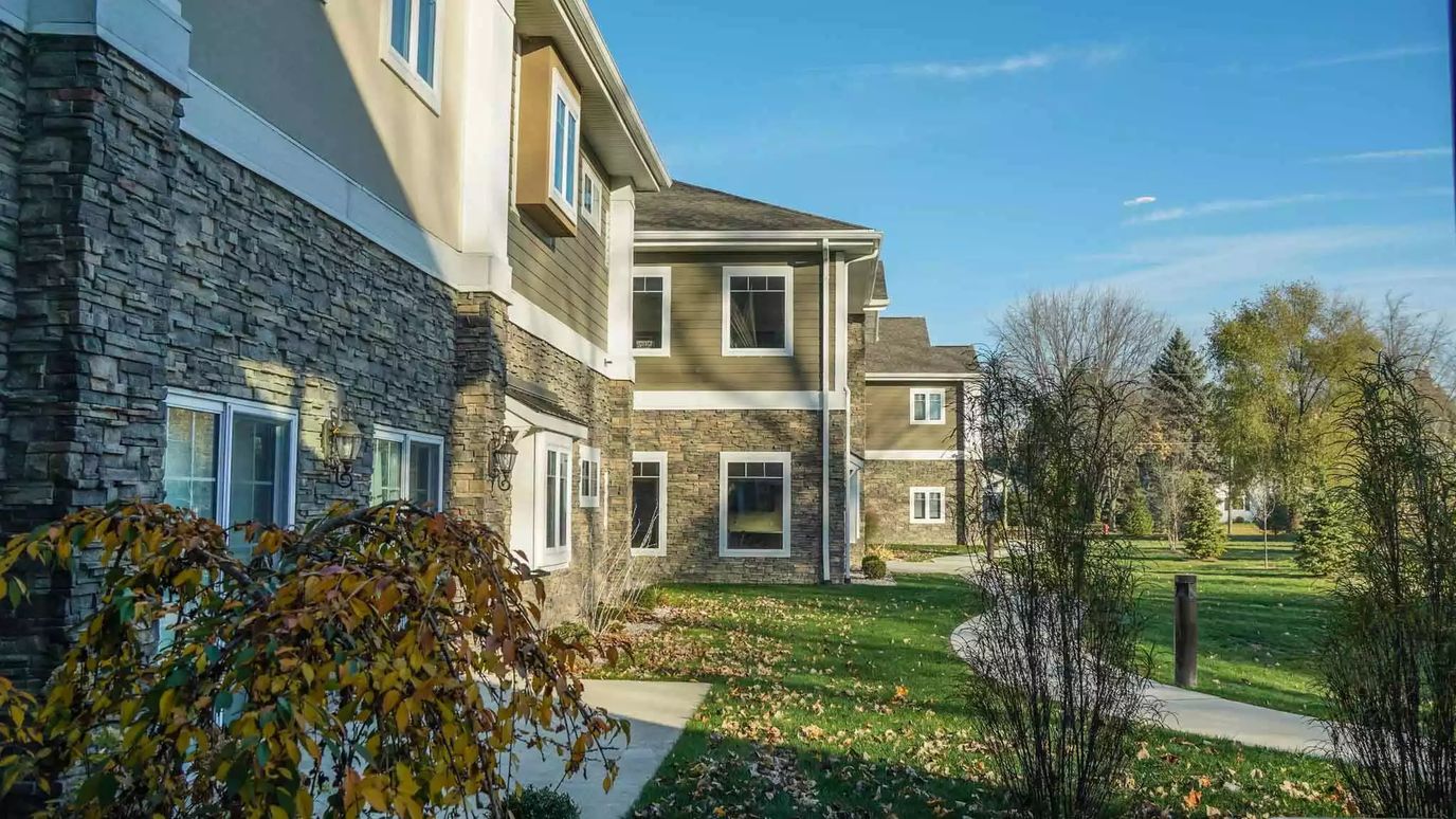 Exterior view of the assisted living facility with landscaping