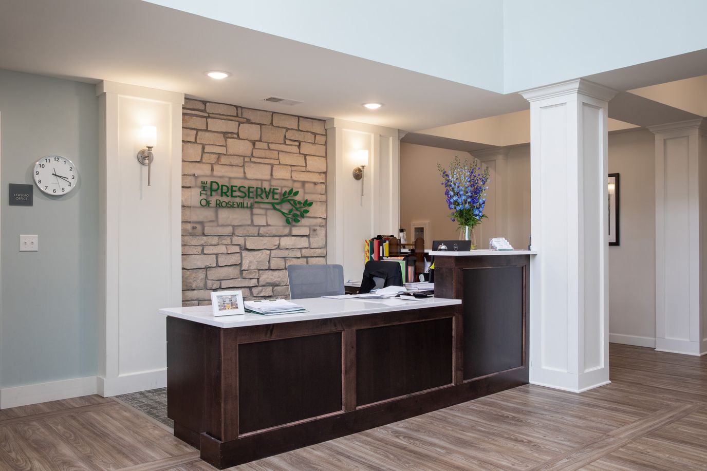Reception area with a welcoming desk and flowers
