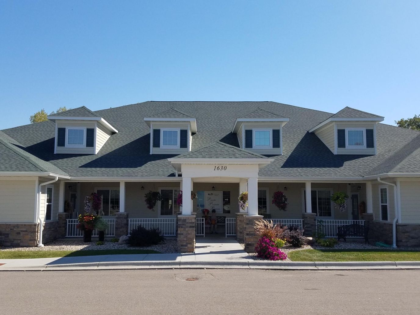 Front exterior of Birchwood Cottages with landscaped entrance