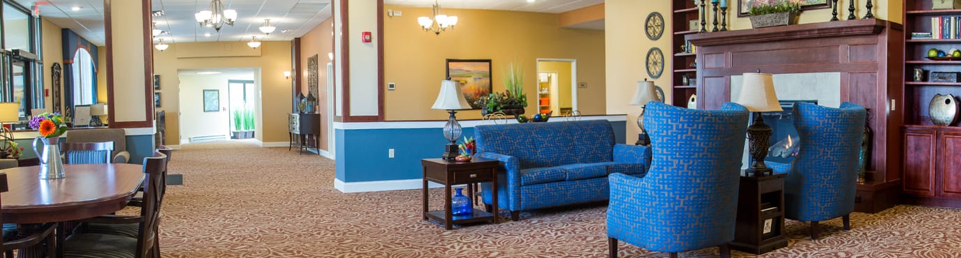 Bright common area with blue furniture and decorative elements