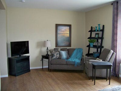 Cozy living room area with sofa and TV