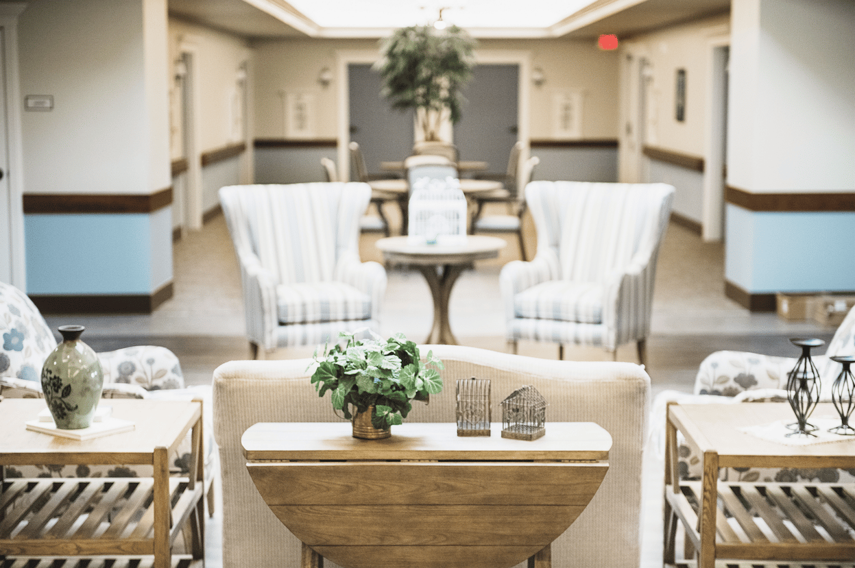 Brightly lit common area with seating and decor