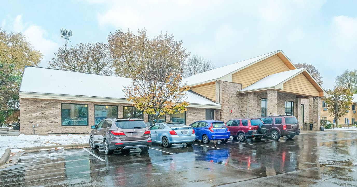 Exterior view of Peaceful Lodge with parking area