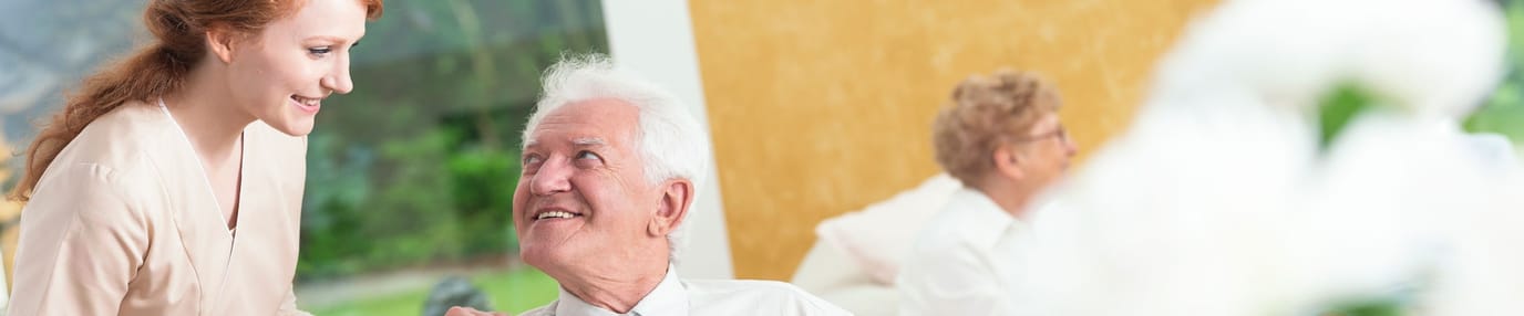 Mountainside of Warm Springs, assisted living in Warm Springs, GA — Caregiver interacting with a senior in a bright setting