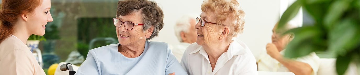 Mountainside of Warm Springs, assisted living in Warm Springs, GA — Seniors engaging in conversation with a staff member