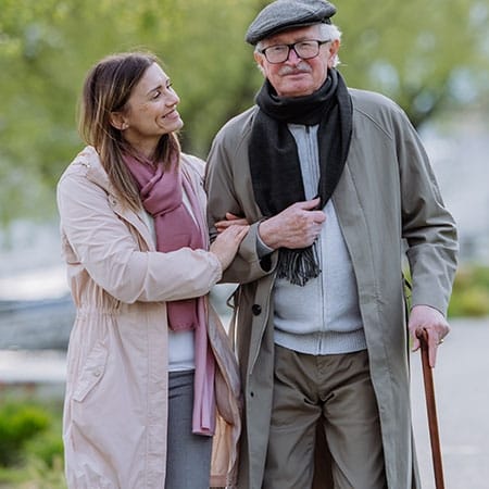 Mountainside of Warm Springs, assisted living in Warm Springs, GA — Couple walking together in a park setting