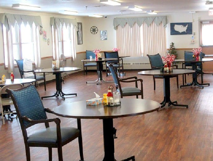 Dining area with tables and chairs set up
