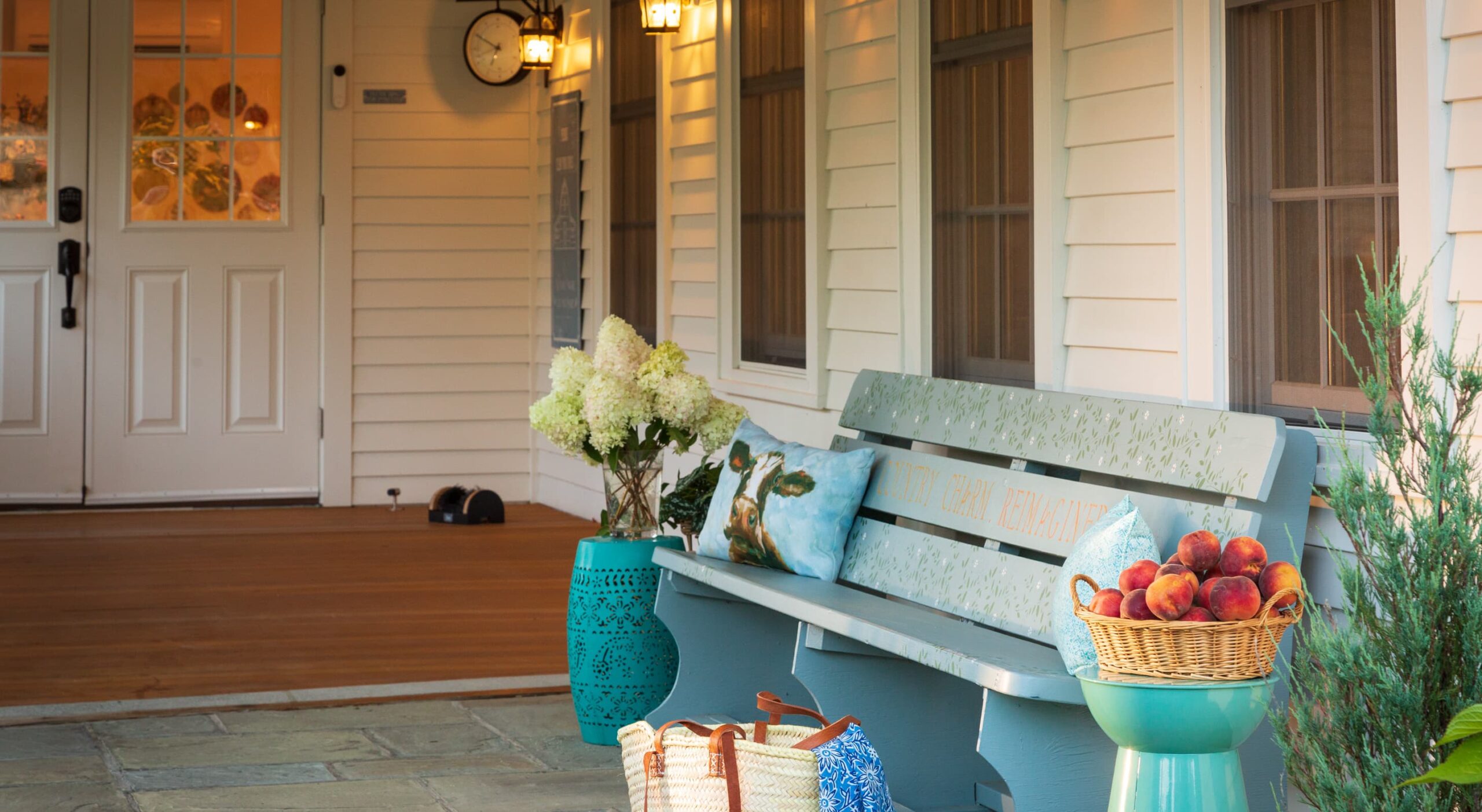 Welcoming porch with bench and decorative items.