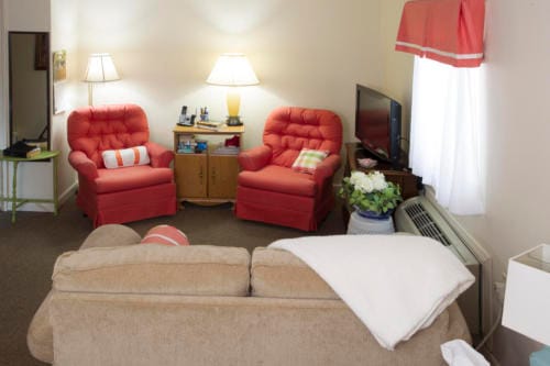 Cozy seating area in a resident's room.