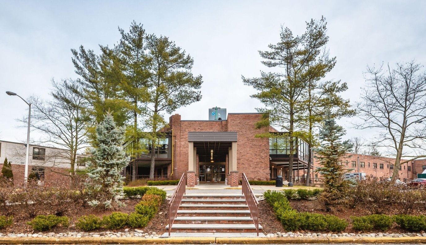Exterior view of Northern Manor with landscaped surroundings