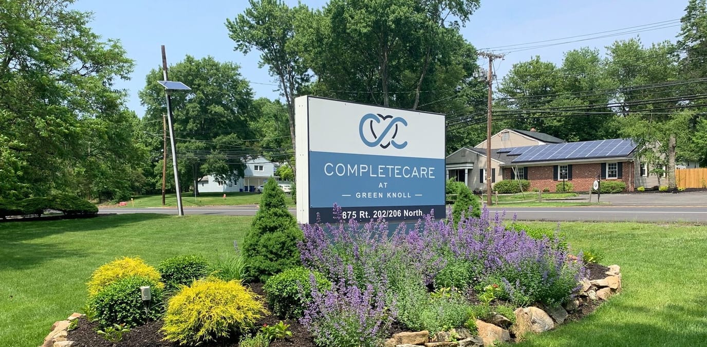 Signage featuring Complete Care at Green Knoll logo