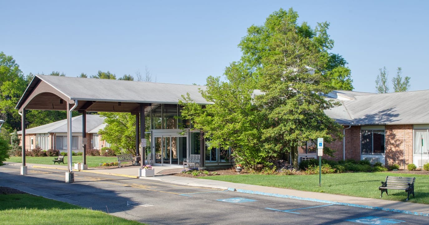 Exterior view of Holly Manor Center with landscaping